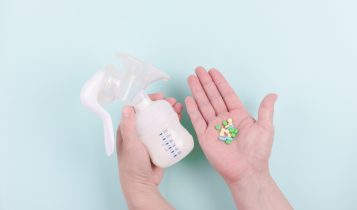 Two,Hands,With,Breast,Pump,And,Drugs,On,Blue,Background.