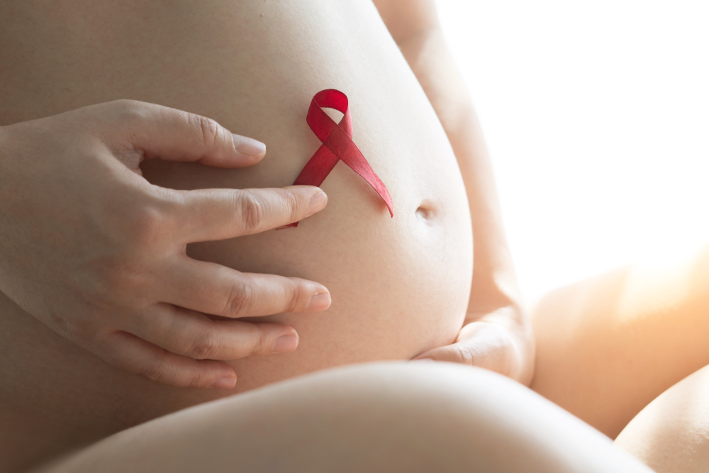 Pregnant,Women,Holding,Red,Ribbon,In,Beautiful,Light,In,World