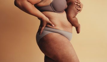 Mid,Section,Of,Plus,Size,Woman,With,Baby.,Body,Positive